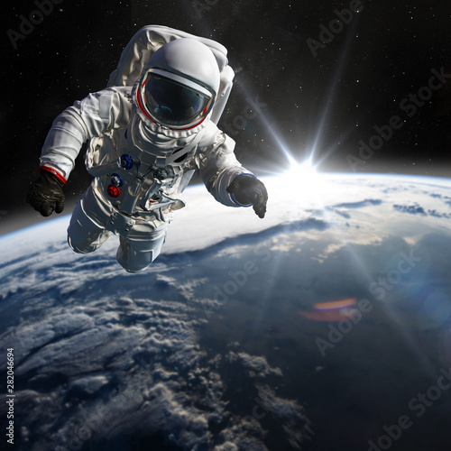 Fototapeta Naklejka Na Ścianę i Meble -  Concept of conquering the universe by the human race. Elements of this image furnished by NASA
