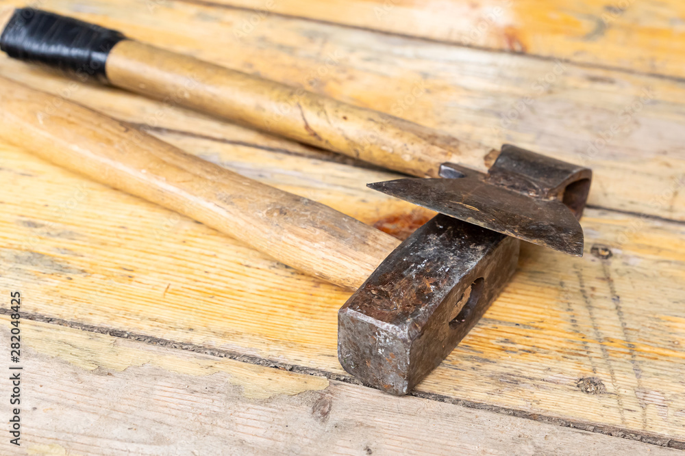 ax hammer set construction building repair traditional tool on light wooden background ax hammer set construction building repair traditional tool on light wooden background