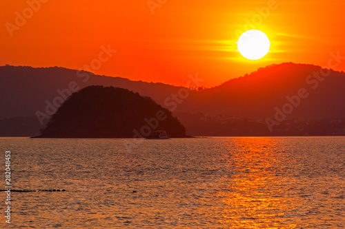 Colorful sunrise on Phuket Island in Thailand. This photograph was taken at a beach in Panwa.