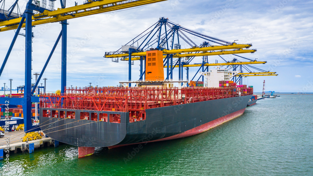 Aerial view cargo ship terminal, Unloading crane of cargo ship terminal, Aerial view industrial port with containers and container ship. Aerial view cargo ship terminal, Unloading crane of cargo ship terminal, Aerial view industrial port with containers and container ship.