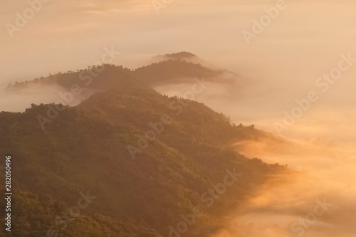 Mountain view misty morning of top hills around with sea of mist in valley background  sunrise at Pha Tang  Chiang Rai  northern of Thailand.