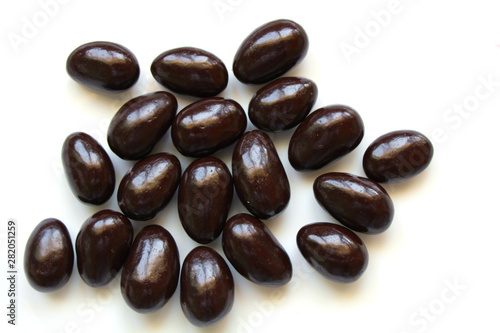 Εκτύπωση καμβά Dark chocolate covered almond candies on white background