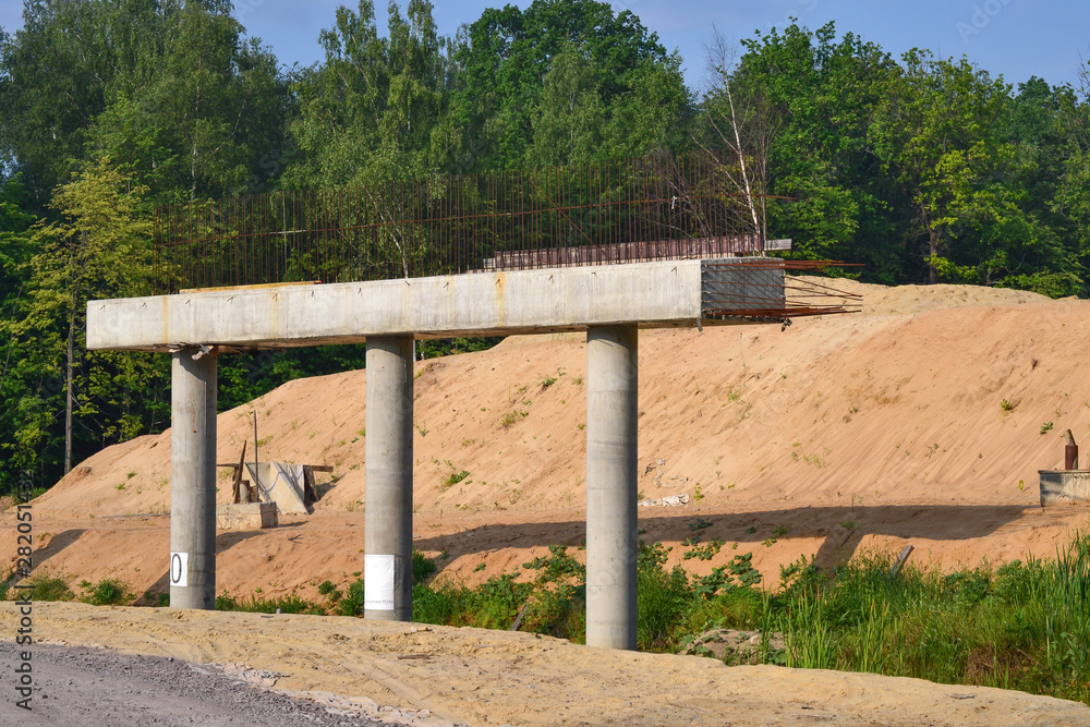 Fragment of the construction of an automobile bridge over the road