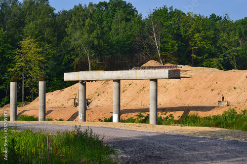 Fragment of the construction of an automobile bridge over the road