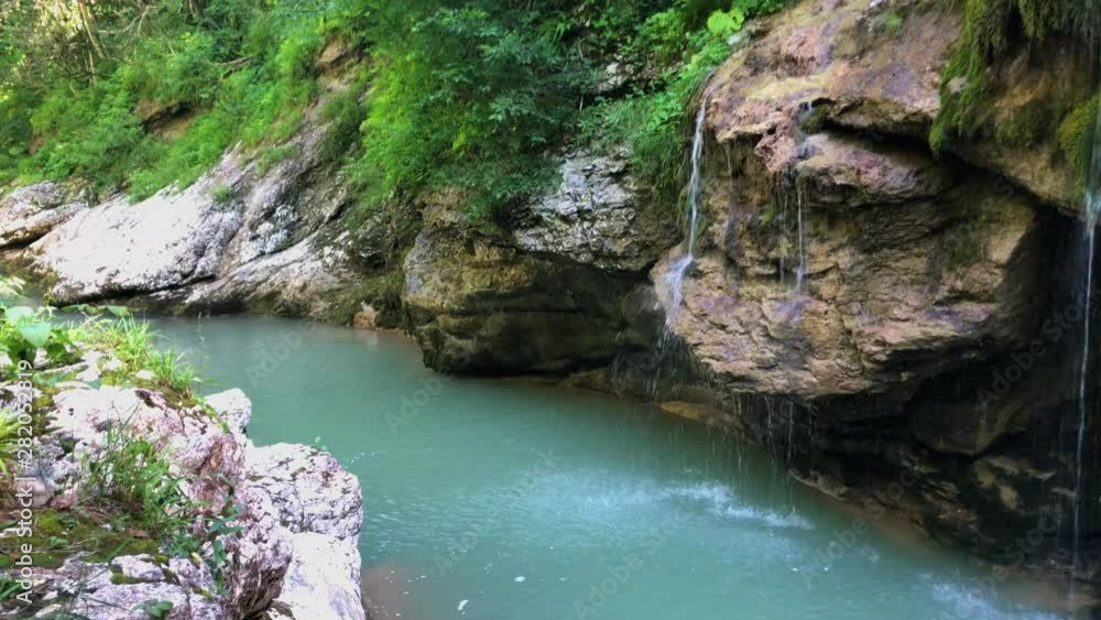 Natural, clean water stream in canyon (Russia, summer) Natural, clean water stream in canyon (Russia, summer)