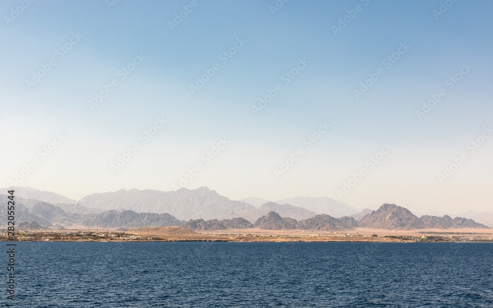 land over the horizon under blue sky