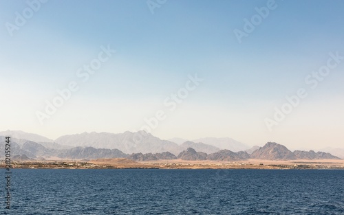 land over the horizon under blue sky