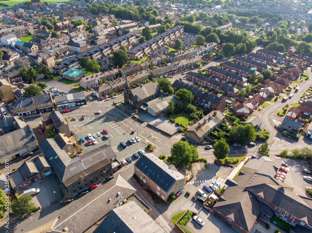 Aerial photo of the Leeds town of Pudsey in West Yorkshire, England showing typical British streets and business taken on a sunny bright summers day.