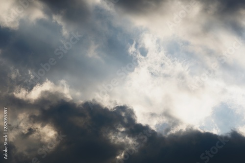 Stormy sky with sunlight at sunset