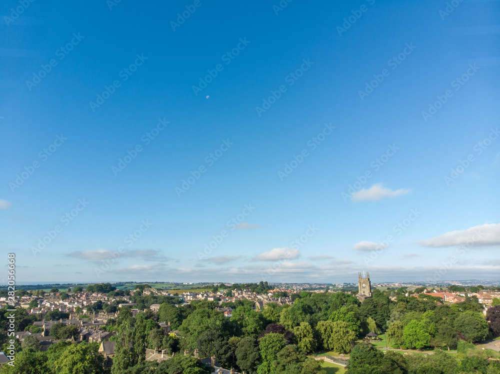 Aerial photo of the Leeds town of Pudsey in West Yorkshire, England showing typical British streets and business taken on a sunny bright summers day.