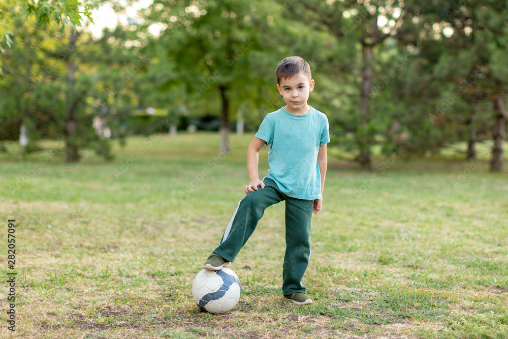 Boys 5-6 five six years old are playing with little ball in park. Boys 5-6 five six years old are playing with little ball in park.