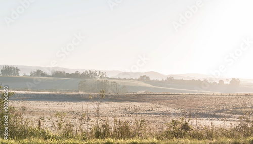 Early morning landscape with frost and fog formation 01