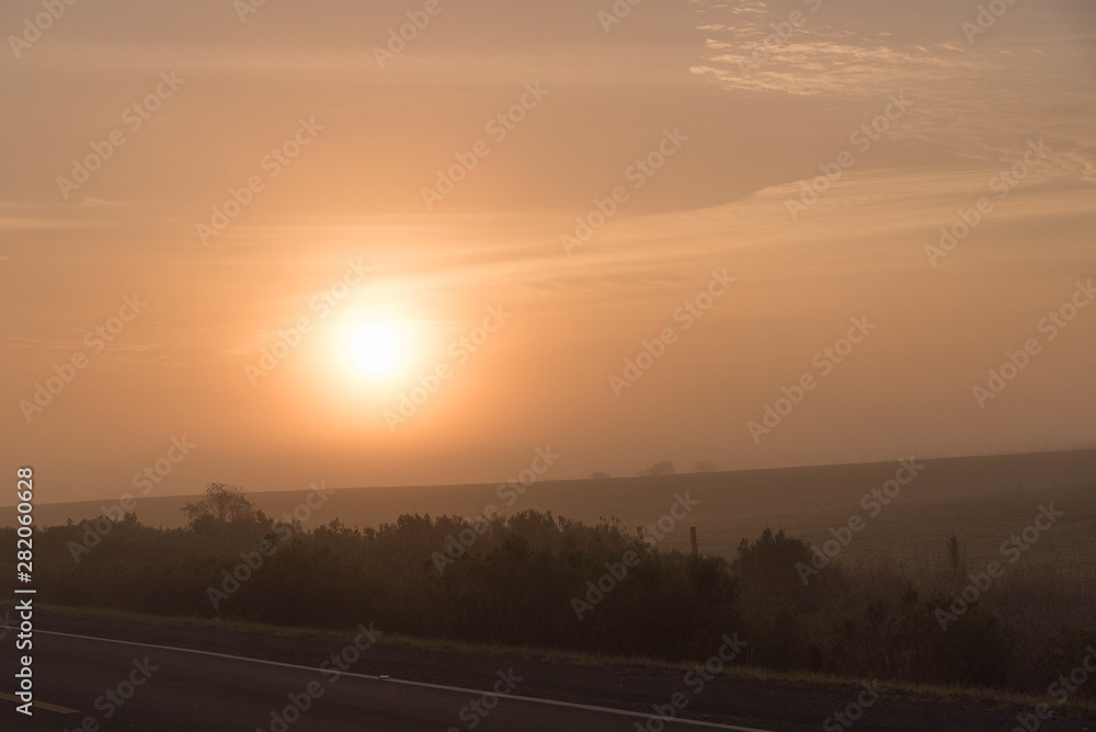 Early morning landscape with sun and fog formation 02
