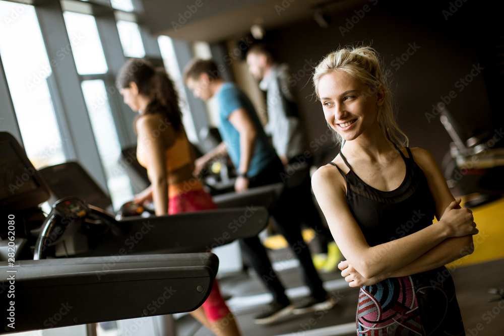 Portrait of young woman standing in the gym Portrait of young woman standing in the gym