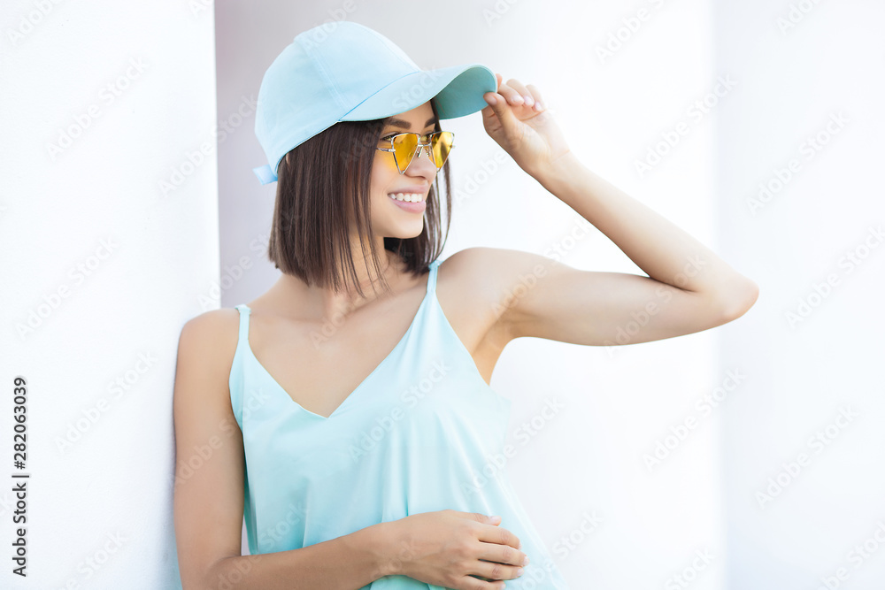 Attractive young woman on neutral white background. Pretty lady walking the city. Closeup portrait of beautiful female. Attractive young woman on neutral white background. Pretty lady walking the city. Closeup portrait of beautiful female.