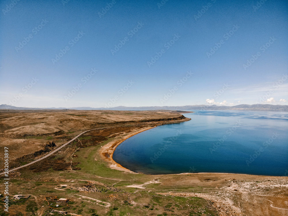 Beautiful view of Sevan lake with turquoise water and green hills, Sevan, Armenia