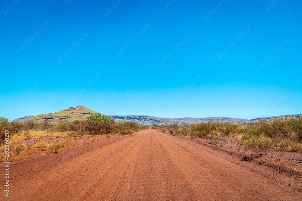 Dirt road at Karijini National Park leading towards Mount Bruce