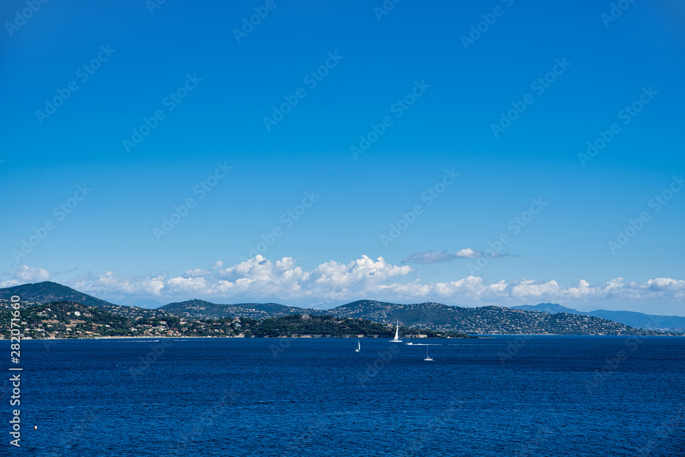 Yachts and boats in the Gulf of Saint-Tropez. Beautiful Bay with yachts and mountain views. Provence CÃ´te D'azur, France