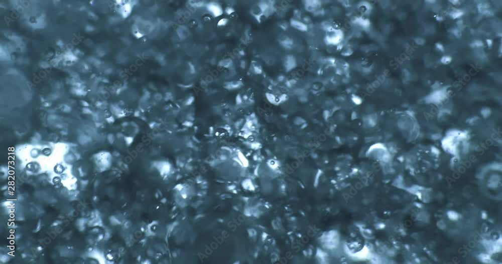 Color drops floating in oil and water over a colorful background Color drops floating in oil and water over a colorful background
