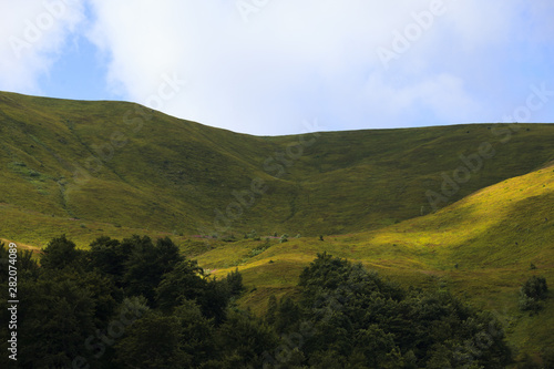 Summer landscape in mountains and blue sky with clouds. Beauty of nature.