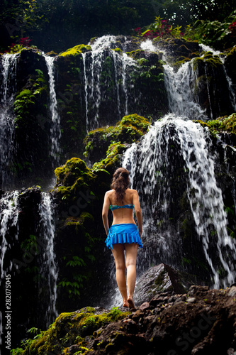 woman in waterfall