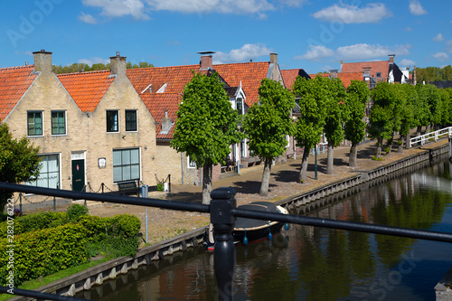 Fototapeta Naklejka Na Ścianę i Meble -  Canal in historic Dutch  town Sloten, Friesland