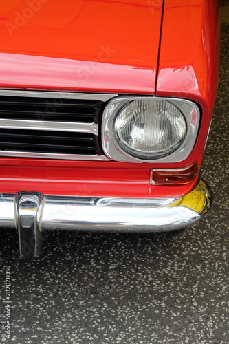 Roter deutscher Kleinwagen mit Stoßstangenhorn der Sechzigerjahre und Siebzigerjahre im Sommer beim Oldtimertreffen Golden Oldies in Wettenberg Krofdorf-Gleiberg bei Gießen in Hessen photo