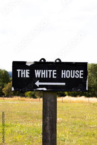 Dilapidated The White House sign in rural Hampshire, namesake of the official residence and workplace of the president of the United States of America