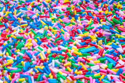 Colorful candy sprinkles close up for birthday cake on white background