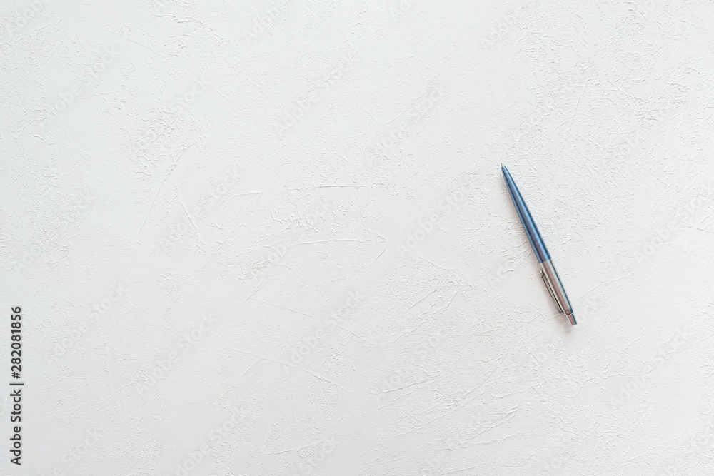 Pen on a textured white background Pen on a textured white background