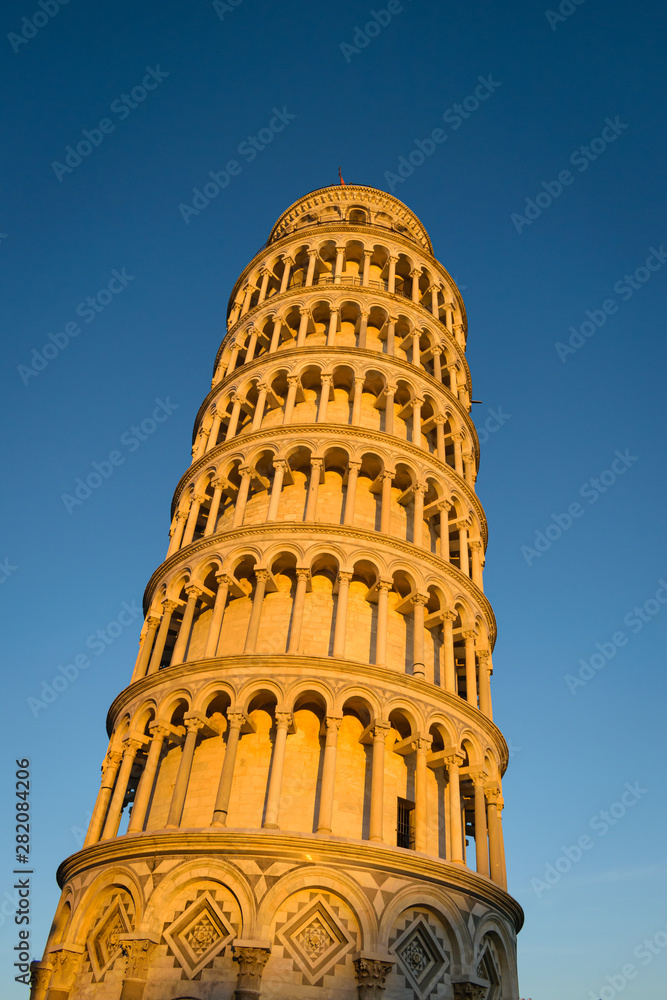 Pisa leaning tower at sunset, Italy