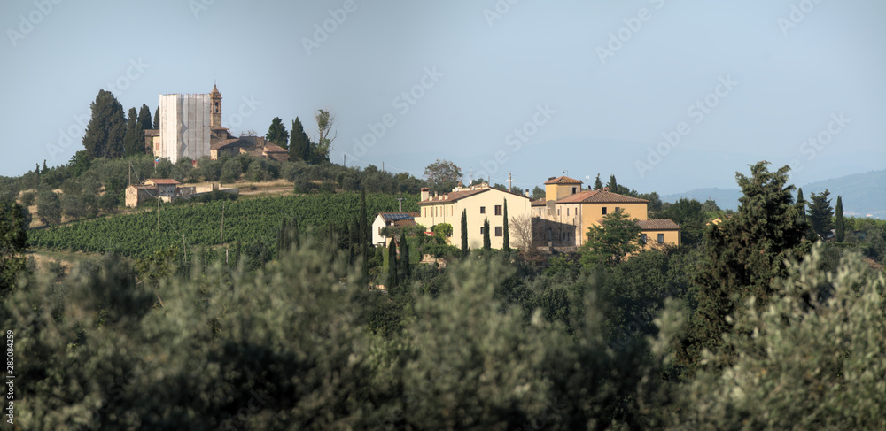 Hilltop settlement in the Tuscan agricultural landscape