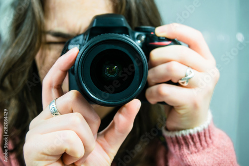 Obraz na plátně young girl taking a picture - close-up