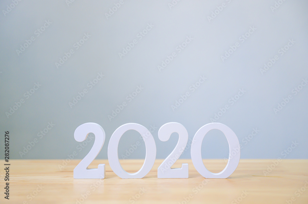 Happy new year 2020, Number wood material on wooden table with white wall background, Copy space Happy new year 2020, Number wood material on wooden table with white wall background, Copy space