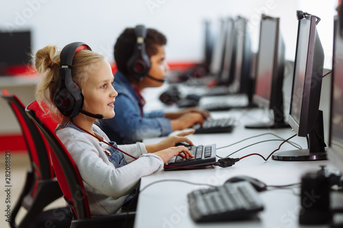 Mixed Racial group Of Elementary School Children In Computer Class