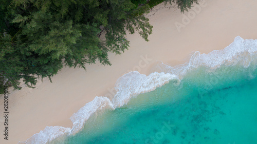 Aerial view of tropical Island white sand beach alonf the pine tree anf turqouise water at Koh Kradan Island, Trang, Thailand. Beach top view. 
