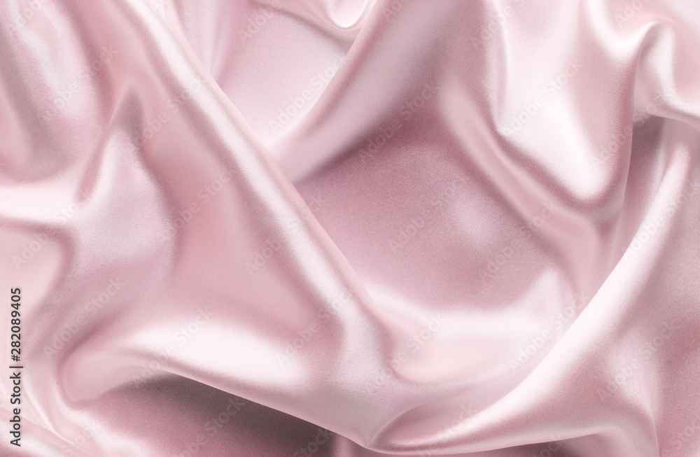 Fototapeta premium delicate pink satin fabric with large folds