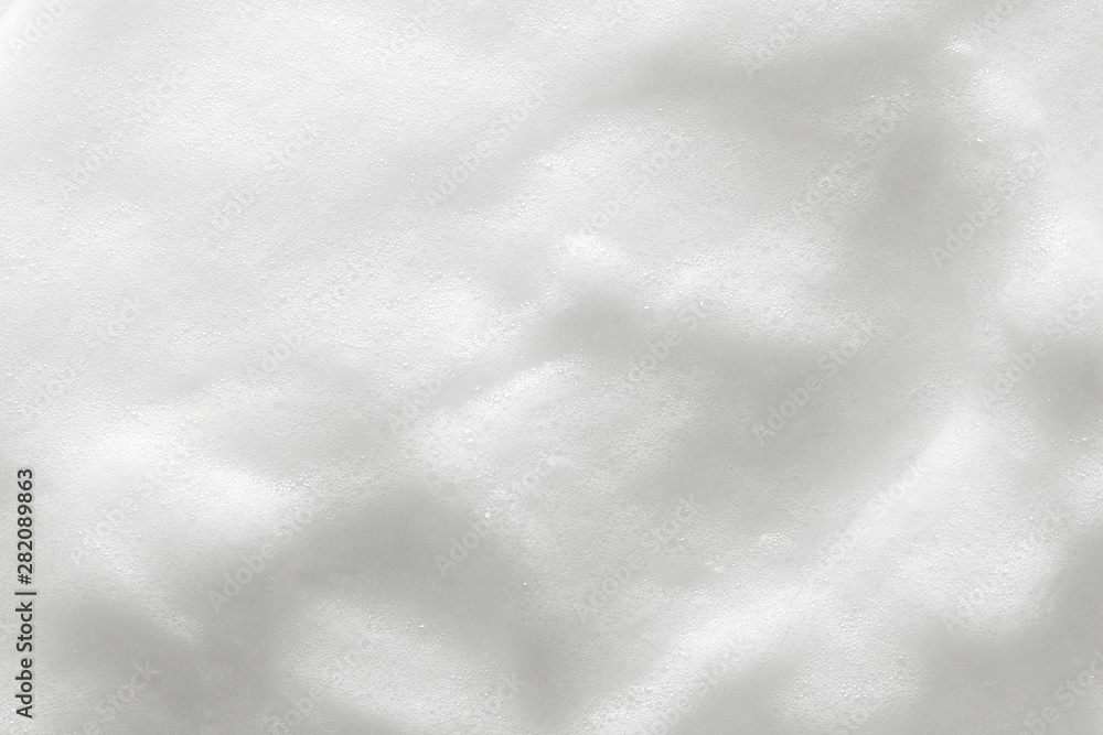 Obraz premium Foam texture background. Cosmetic soap, cleanser, shampoo bubbles. Macro, top view