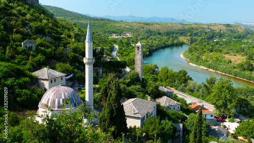 Bosnia and Herzegovina, village with mosque and turquoise river- pocitelj photo