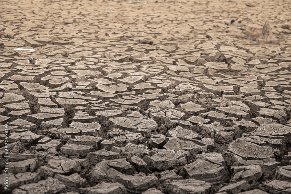 Climate change and drought land, Part of a Huge Area of Dried Land Suffering from Drought - in Cracks Climate change and drought land, Part of a Huge Area of Dried Land Suffering from Drought - in Cracks