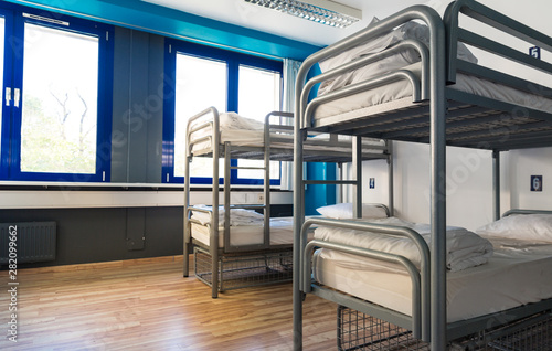 Hostel interior, bunk beds and linen, nobody