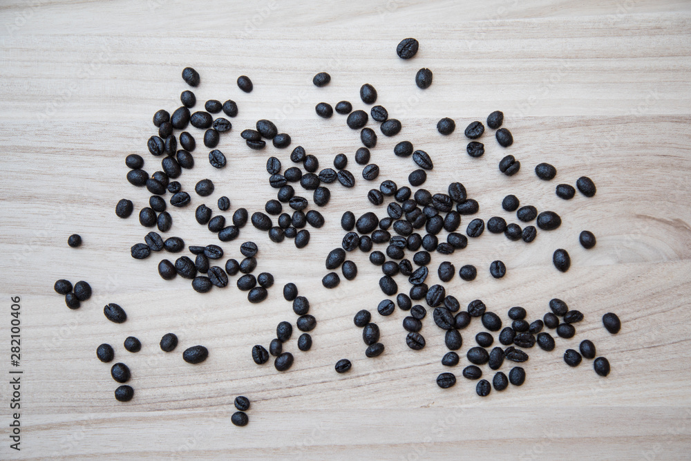 Coffe beans on a natural wooden background Coffe beans on a natural wooden background