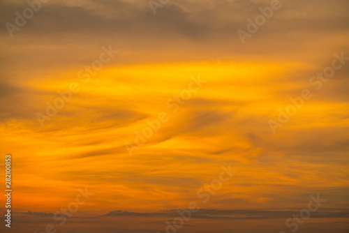 Sunset sky background, colorful sky, bright yellow cloud