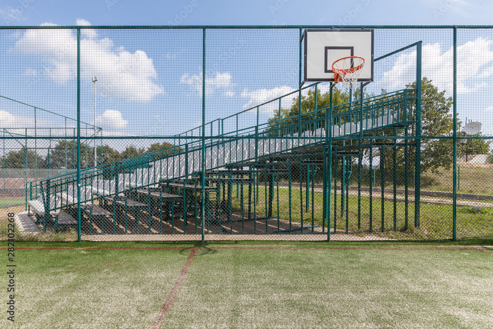 Sports playground for basketball and football by the mountains Sports playground for basketball and football by the mountains