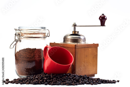Coffee grinder and empty cup, coffee bean