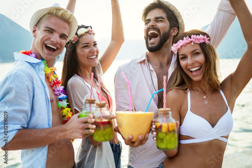 Carefree young friends enjoying summer party together