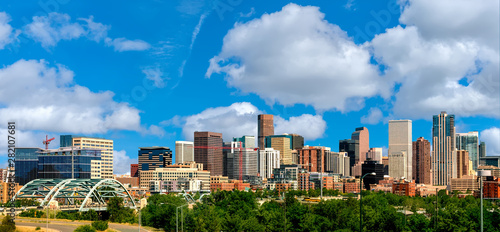 Photography Colorful skyline of Denver Colorado with clouds in the sky