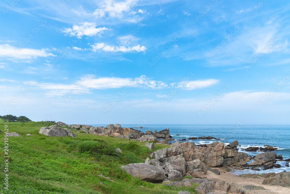Fototapeta premium Beautiful Tanesashi kaigan Coast. The coastline includes both sandy and rocky beaches, and grassy meadows scenic views