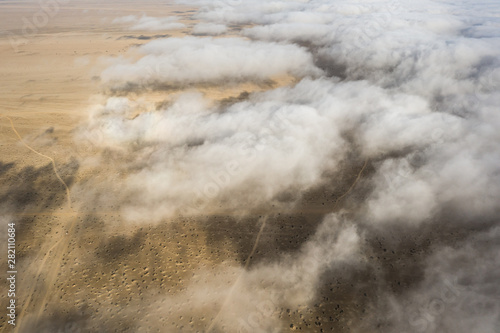 Coastal fog rolling over the desert landscape of Skeleton coast. Skeleton coast, Namibia. © Kertu