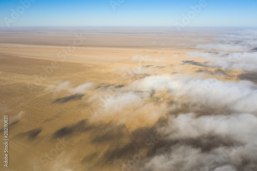 Coastal fog rolling over the desert landscape of Skeleton coast. Skeleton coast, Namibia.